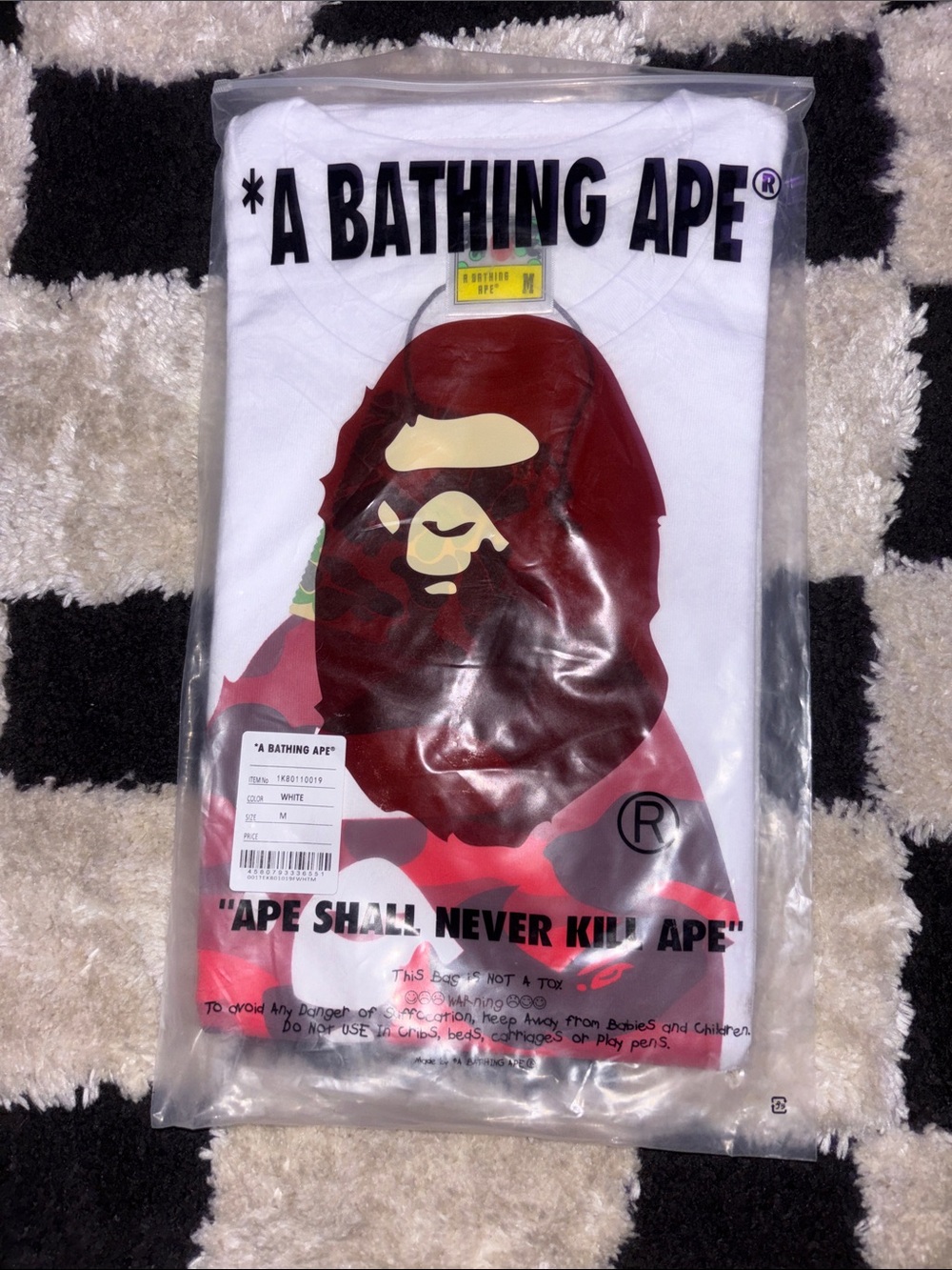 A Bathing Ape White Short Sleeve Graphic Tee with Red Ape Print